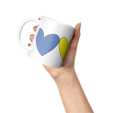 Load image into Gallery viewer, FOUR_HEARTS_WRAP_AROUND_Lifestyle_Raised_Hand_LH_Mockup.png
